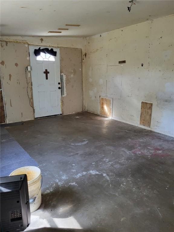 entryway with concrete floors