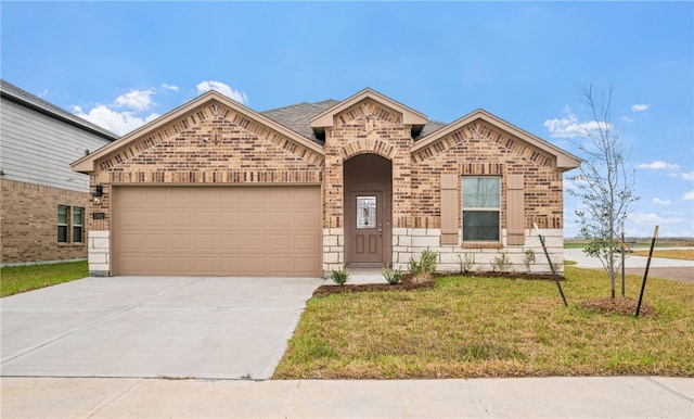 view of front of home with brick siding, a shingled roof, an attached garage, driveway, and a front lawn