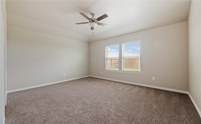 unfurnished room featuring ceiling fan, carpet flooring, and baseboards