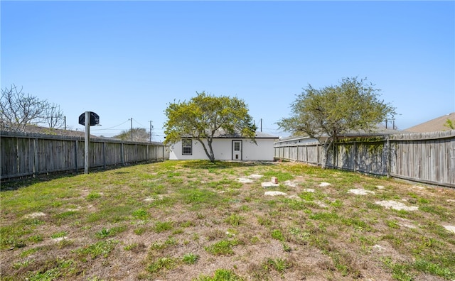 view of yard with a fenced backyard