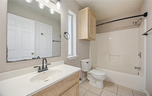 bathroom featuring toilet, tile patterned flooring, baseboards, bathing tub / shower combination, and vanity