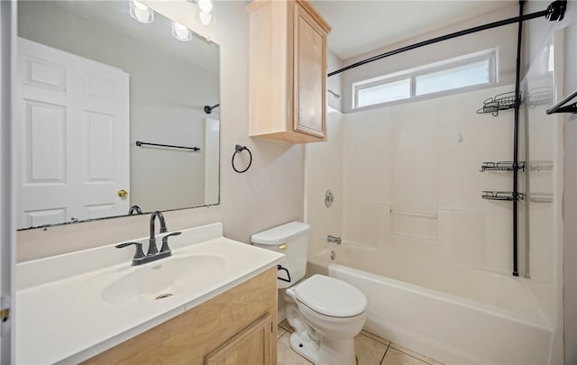 full bathroom with tile patterned floors, washtub / shower combination, toilet, and vanity