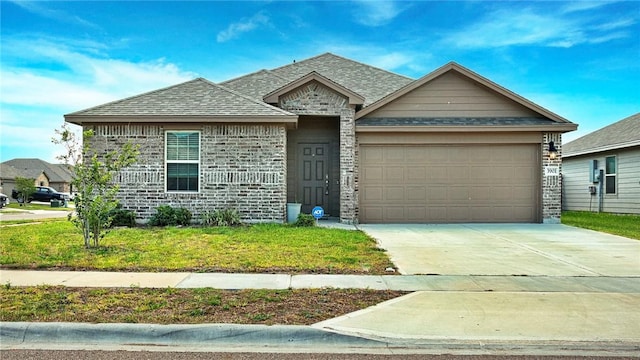 3901 Jayden Dr, Corpus Christi, TX 78410 - view of front of home with an attached garage, driveway, roof with shingles, and a front yard