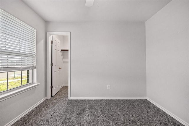 3901 Jayden Dr, Corpus Christi, TX 78410 - unfurnished bedroom featuring carpet flooring, baseboards, a walk in closet, and a ceiling fan