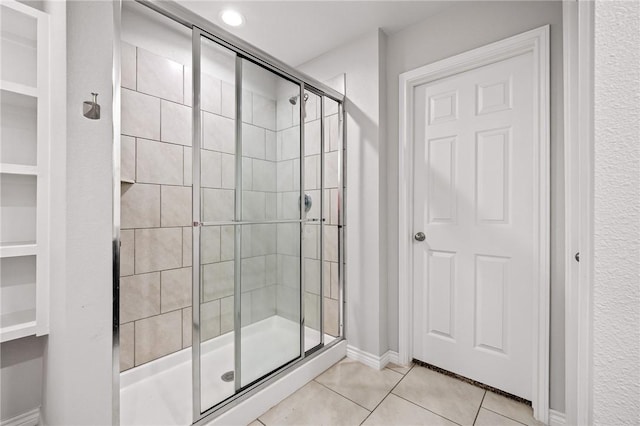 3901 Jayden Dr, Corpus Christi, TX 78410 - bathroom featuring a stall shower, tile patterned floors, and baseboards