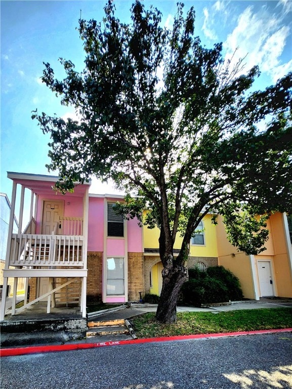 view of front of home with a balcony