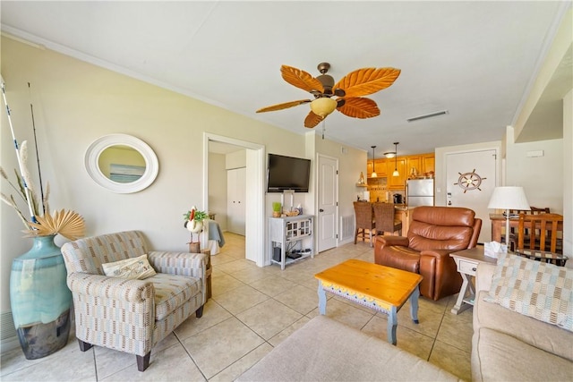 14514 E Cabana St, Corpus Christi, TX 78418 - living room featuring ceiling fan, ornamental molding, and light tile patterned flooring