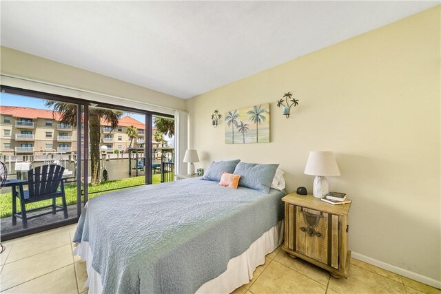 14514 E Cabana St, Corpus Christi, TX 78418 - tiled bedroom with access to outside and baseboards