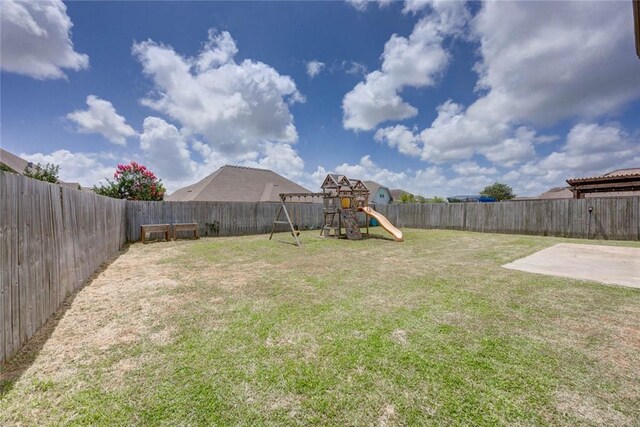7706 Fort Griffen Dr, Corpus Christi, TX 78414 - view of yard with a playground and a patio