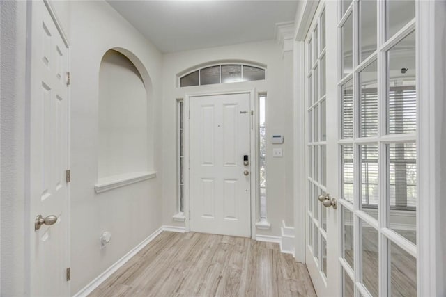 7706 Fort Griffen Dr, Corpus Christi, TX 78414 - foyer entrance featuring light wood finished floors, french doors, and baseboards