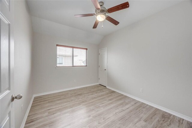 7706 Fort Griffen Dr, Corpus Christi, TX 78414 - spare room featuring light wood-style flooring, baseboards, ceiling fan, and vaulted ceiling