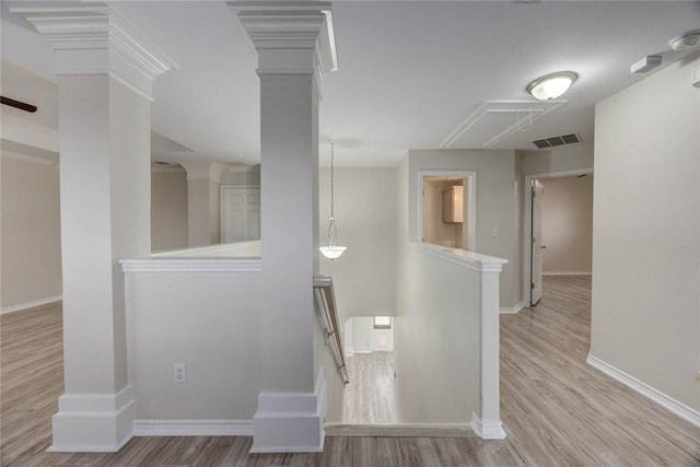 7706 Fort Griffen Dr, Corpus Christi, TX 78414 - hallway featuring an upstairs landing, wood finished floors, baseboards, and attic access