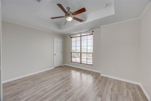 7706 Fort Griffen Dr, Corpus Christi, TX 78414 - unfurnished room featuring a raised ceiling, light wood-style flooring, ceiling fan, a smoke detector, and baseboards