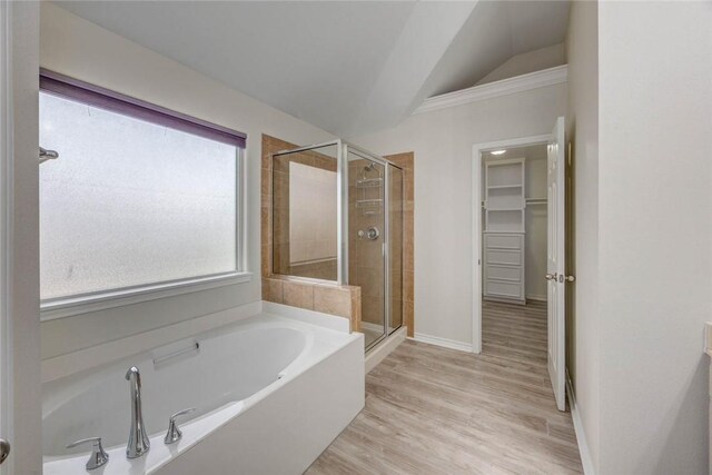 7706 Fort Griffen Dr, Corpus Christi, TX 78414 - bathroom with a shower stall, a bath, lofted ceiling, a spacious closet, and baseboards