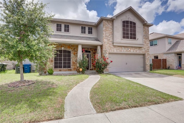 7706 Fort Griffen Dr, Corpus Christi, TX 78414 - traditional home with an attached garage, driveway, stone siding, and a front lawn
