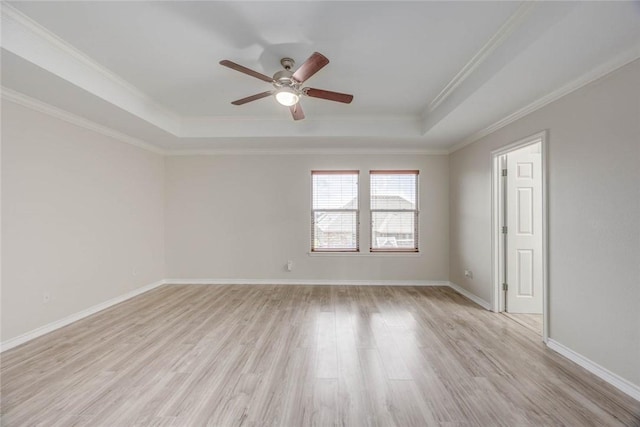 7706 Fort Griffen Dr, Corpus Christi, TX 78414 - unfurnished room featuring a tray ceiling, a ceiling fan, light wood finished floors, crown molding, and baseboards