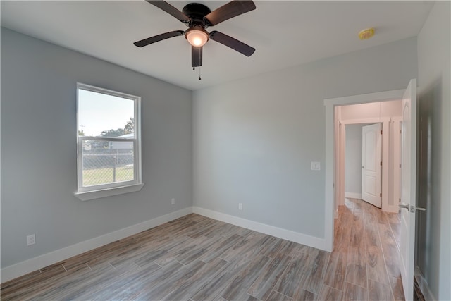 unfurnished room with light hardwood / wood-style floors and ceiling fan