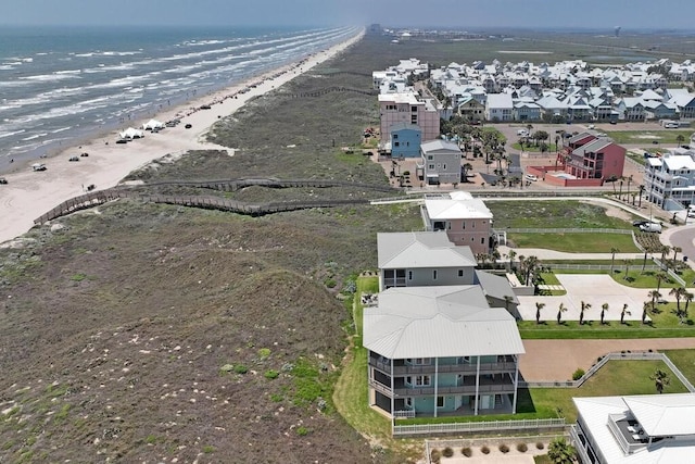 aerial view featuring a water view and a view of the beach