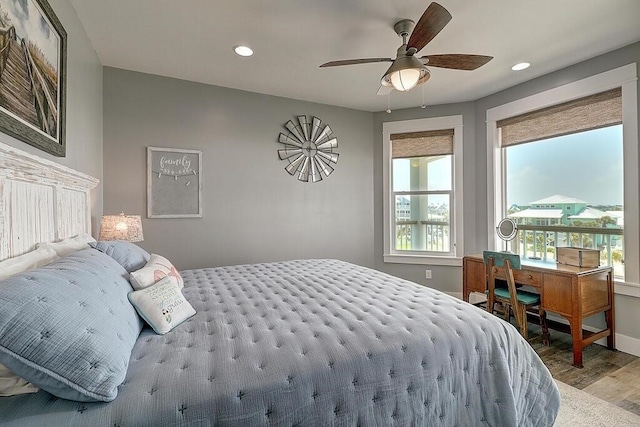 bedroom with ceiling fan and light hardwood / wood-style flooring