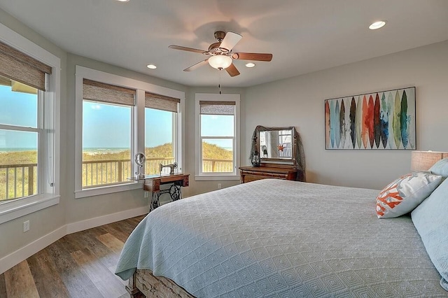 bedroom with hardwood / wood-style floors and ceiling fan