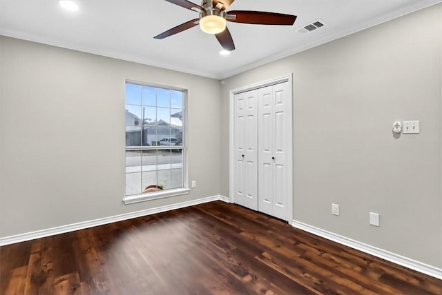 15341 Yardarm Ct, Corpus Christi, TX 78418 - unfurnished bedroom with dark wood-style floors, recessed lighting, a closet, crown molding, and a ceiling fan