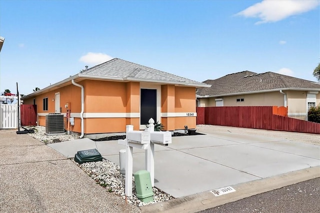 15341 Yardarm Ct, Corpus Christi, TX 78418 - view of property exterior with stucco siding and roof with shingles