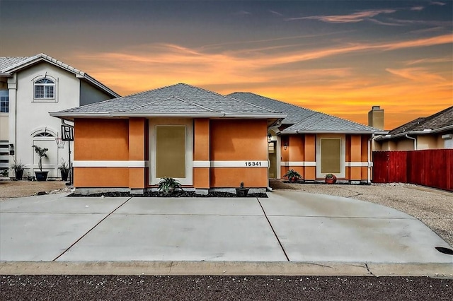 15341 Yardarm Ct, Corpus Christi, TX 78418 - back of house at dusk with stucco siding