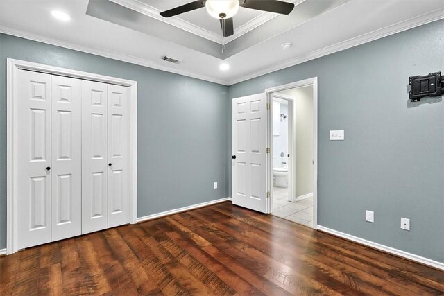 15341 Yardarm Ct, Corpus Christi, TX 78418 - unfurnished bedroom with a raised ceiling, wood finished floors, ornamental molding, a closet, and ceiling fan