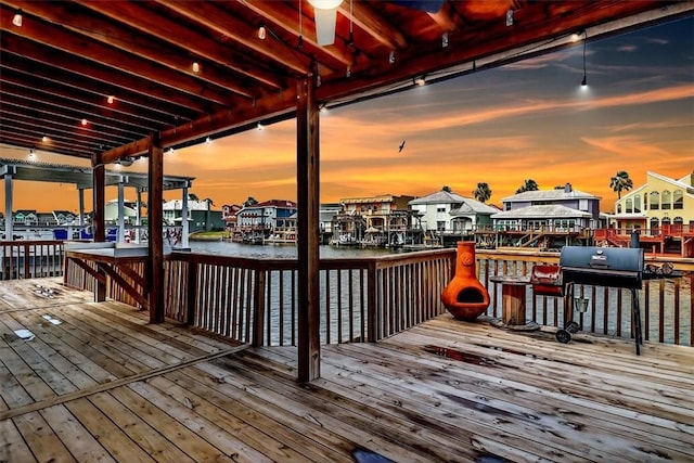 15341 Yardarm Ct, Corpus Christi, TX 78418 - deck at dusk with a water view, area for grilling, and a residential view