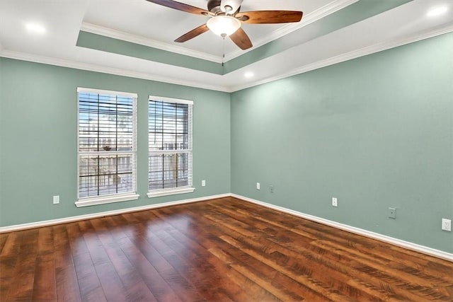 15341 Yardarm Ct, Corpus Christi, TX 78418 - unfurnished room featuring dark wood-type flooring, ceiling fan, a raised ceiling, crown molding, and recessed lighting