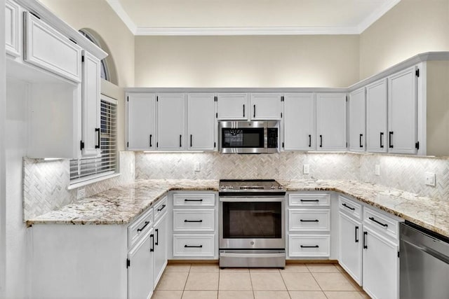 15341 Yardarm Ct, Corpus Christi, TX 78418 - kitchen with stainless steel appliances, crown molding, tasteful backsplash, and light tile patterned flooring