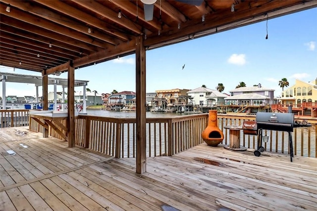 15341 Yardarm Ct, Corpus Christi, TX 78418 - deck with a residential view, a grill, a water view, and ceiling fan
