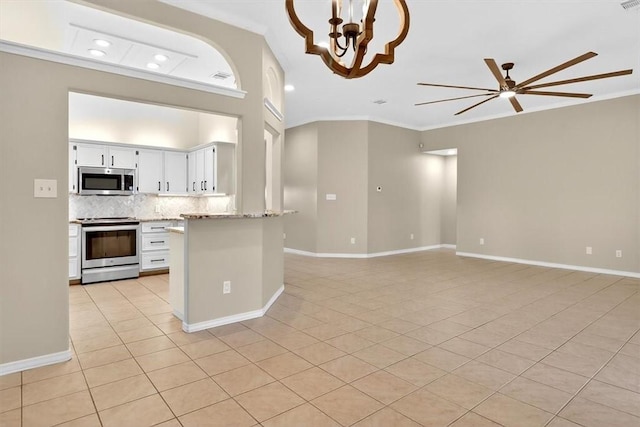 15341 Yardarm Ct, Corpus Christi, TX 78418 - kitchen with appliances with stainless steel finishes, crown molding, recessed lighting, open floor plan, and backsplash