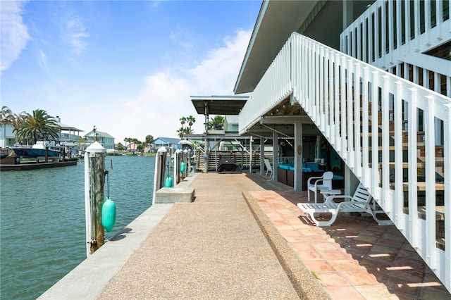 dock area with a water view