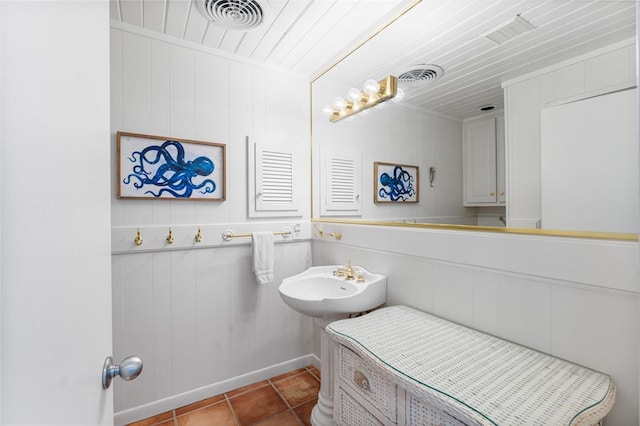 bathroom with a sink, visible vents, and tile patterned flooring