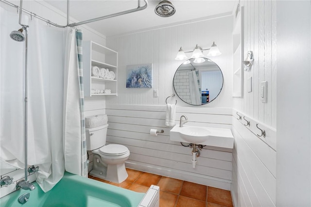 bathroom with tile patterned floors, toilet, and a shower with shower curtain