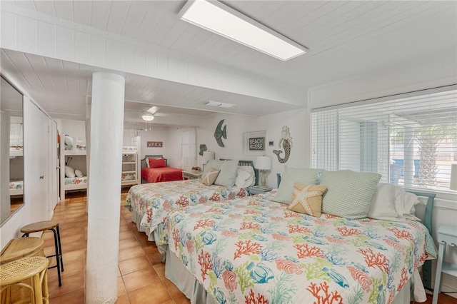 bedroom featuring light tile patterned floors and a ceiling fan