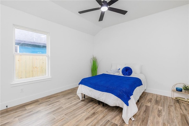 2513 Luzius Dr, Corpus Christi, TX 78418 - bedroom featuring lofted ceiling, wood finished floors, baseboards, and a ceiling fan