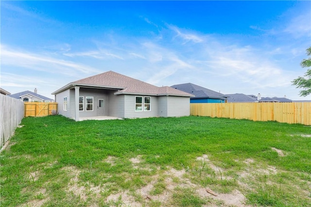 2513 Luzius Dr, Corpus Christi, TX 78418 - rear view of property featuring roof with shingles and a patio area