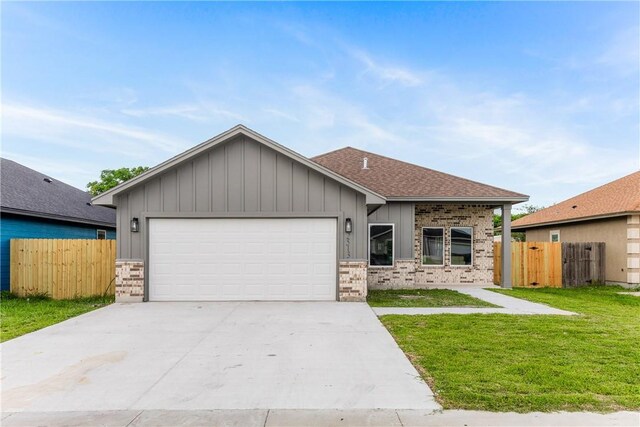 2513 Luzius Dr, Corpus Christi, TX 78418 - ranch-style house featuring board and batten siding, brick siding, a garage, concrete driveway, and roof with shingles