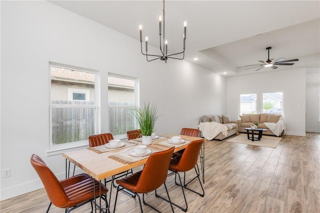 2513 Luzius Dr, Corpus Christi, TX 78418 - dining room with a chandelier, light wood-type flooring, baseboards, recessed lighting, and ceiling fan