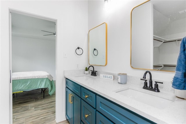 2513 Luzius Dr, Corpus Christi, TX 78418 - bathroom with wood finished floors and double vanity