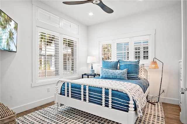 bedroom featuring hardwood / wood-style floors and ceiling fan