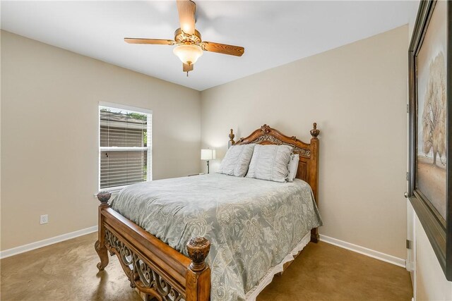 carpeted bedroom featuring baseboards and ceiling fan
