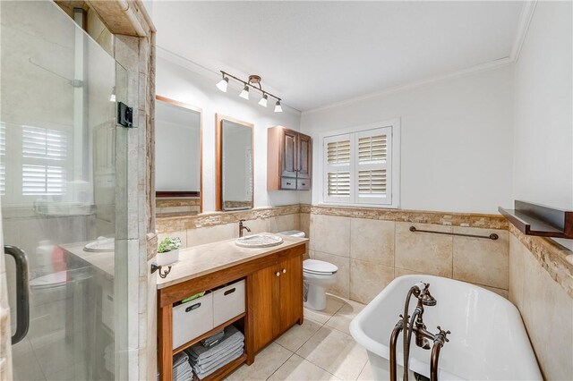full bathroom with tile walls, ornamental molding, a freestanding bath, a shower stall, and vanity