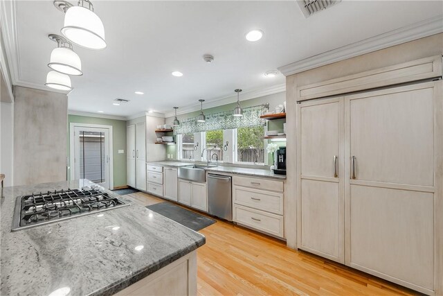 kitchen featuring open shelves, a sink, stainless steel appliances, ornamental molding, and recessed lighting