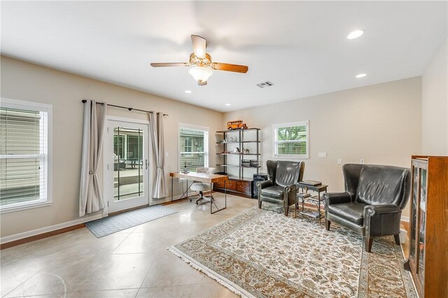 sitting room with a desk, ceiling fan, recessed lighting, and baseboards