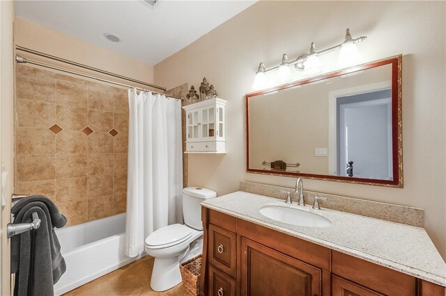 bathroom featuring toilet, vanity, and shower / bath combination with curtain