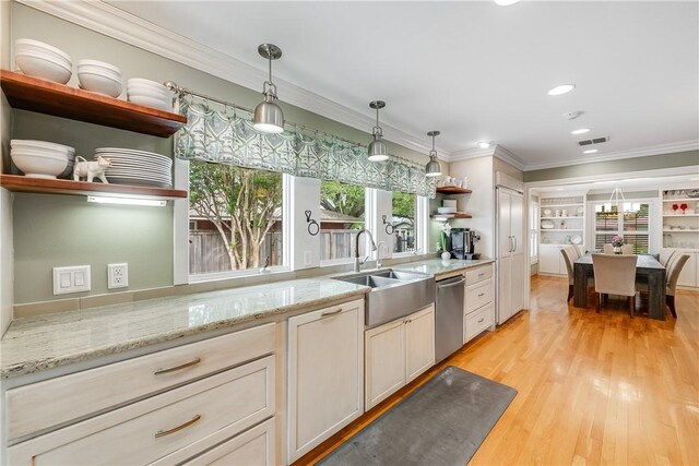 kitchen featuring open shelves, a sink, stainless steel dishwasher, light wood-style floors, and ornamental molding