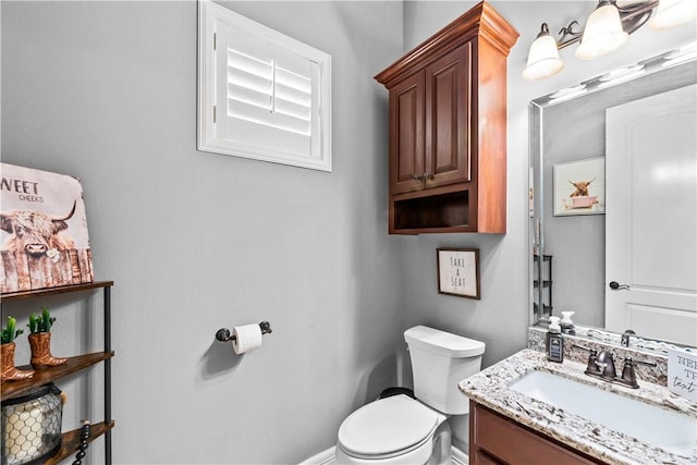 221 Deer Meadows Dr, Alice, TX 78332 - bathroom featuring toilet, vanity, and baseboards